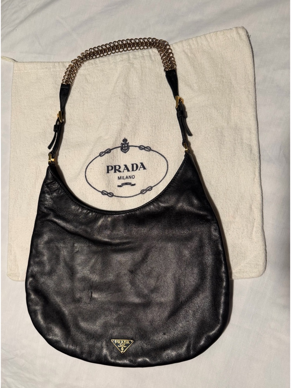 Prada Black Leather Hobo with Gold Chain Accent and dust bag .